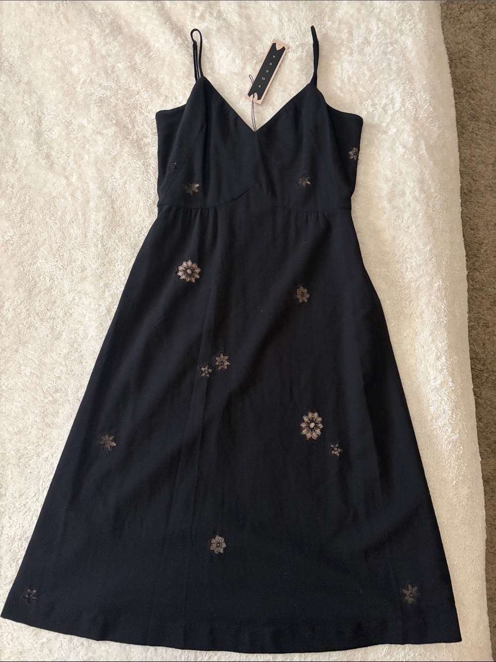 Tocca Black Wool Slip Dress with blush silk lining and floral cut out detail.
